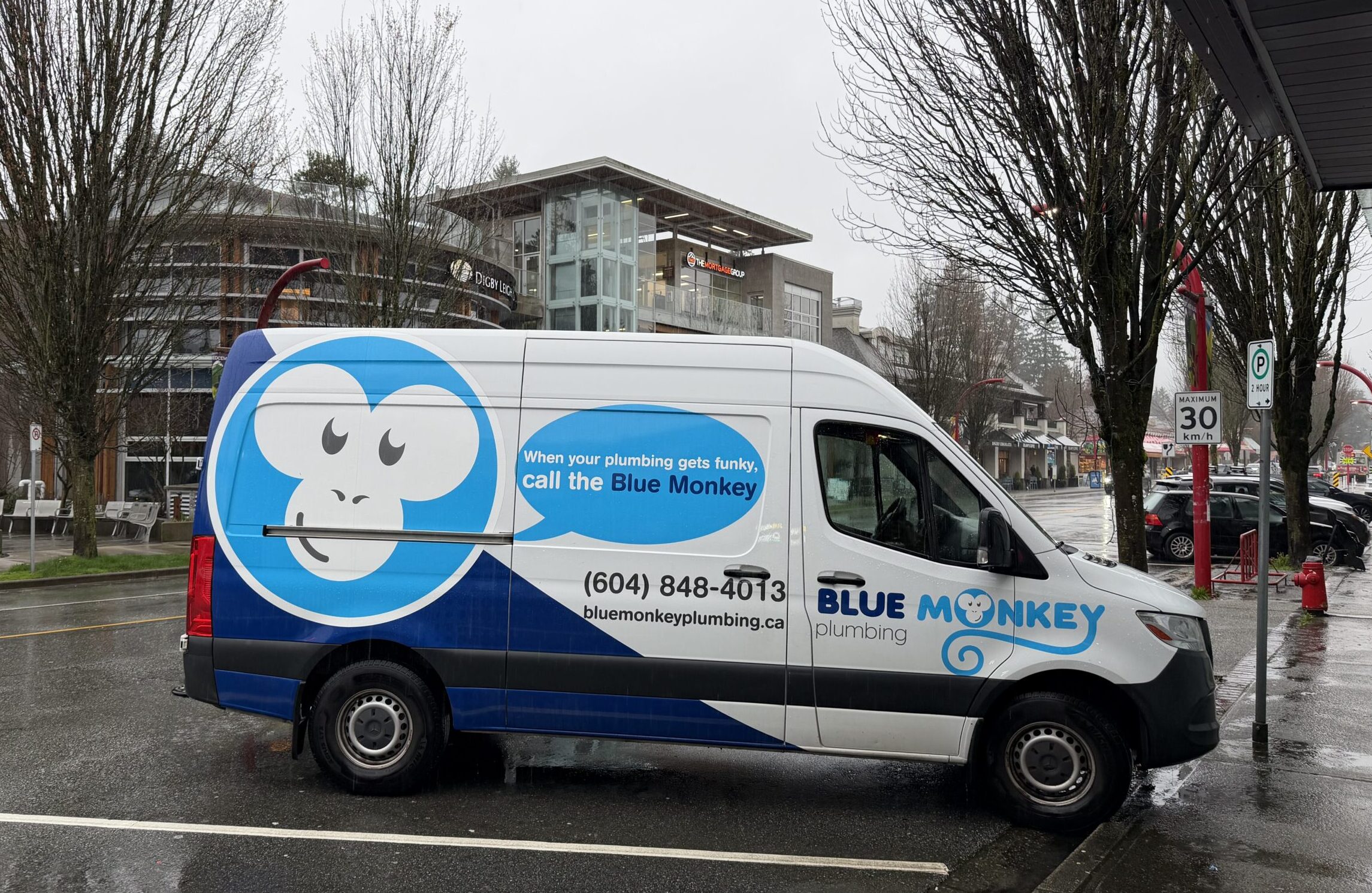 Blue Monkey Plumbing service van parked in Edgemont Village, North Vancouver