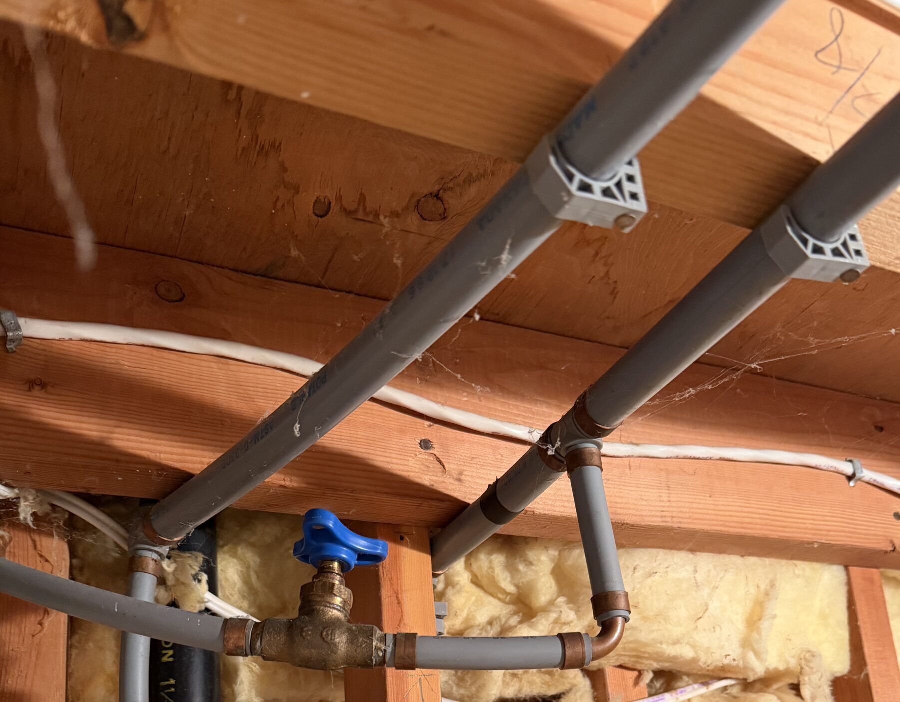 Poly B piping exposed inside a wall in a West Vancouver home